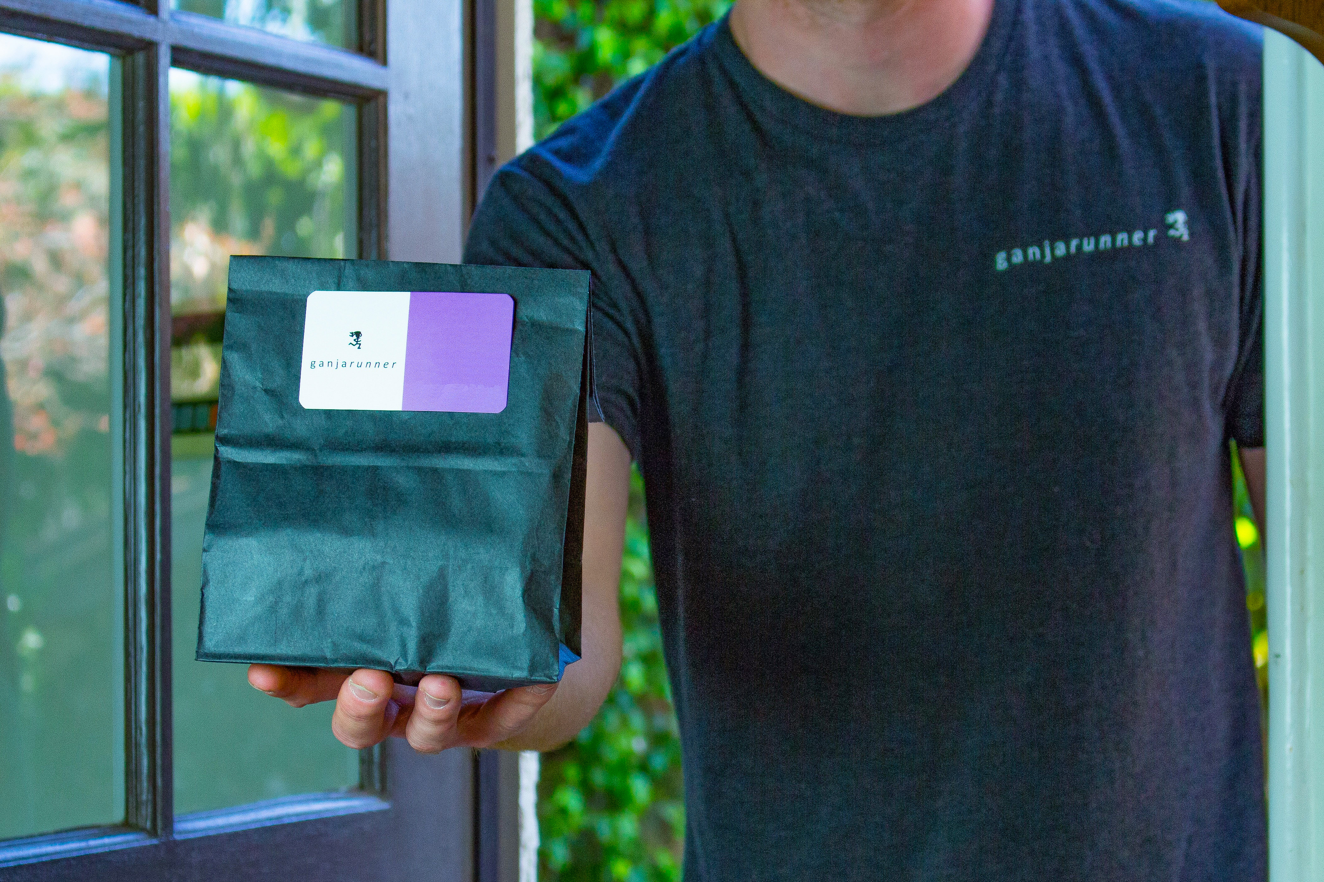 Delivery man delivering cannabis.